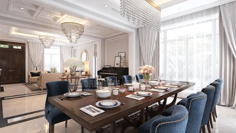 Thiết kế phòng ăn liền phòng khách đẹp, sang trọng ấn tượng với sắc xanh nổi bật từ bộ bàn ghế cùng lối thiết kế nội thất tân cổ điển quý phái. Thiết kế phòng ăn biệt thự